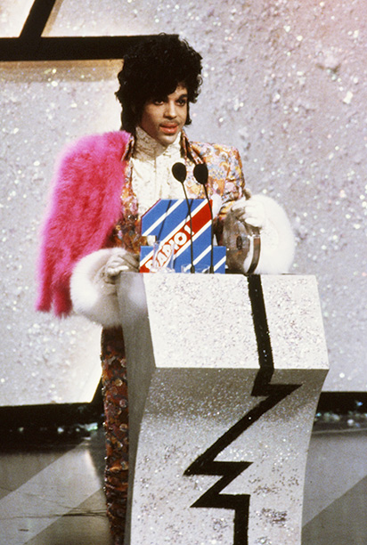 American singer, songwriter and musician Prince collects the award for Best International Artist at the British Record Industry Awards, aka the BRIT Awards, held at the Grosvenor House Hotel in London, 11th February 1985. (Photo by Georges De Keerle/Getty Images)
