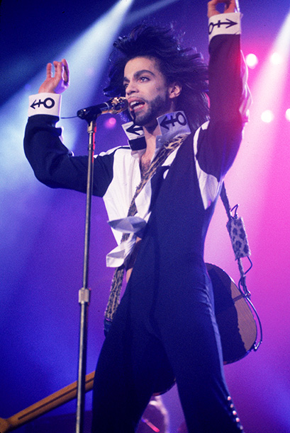 American singer and songwriter Prince performs in concert, singing with a guitar strapped behind his back, Wembley Arena, London, England, July 1990. (Photo by Frank Micelotta/Getty Images)